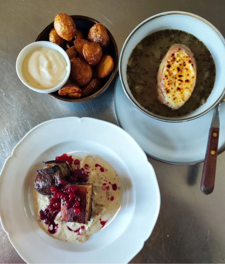 Three plates of food from Röstånga Station carefully plated.